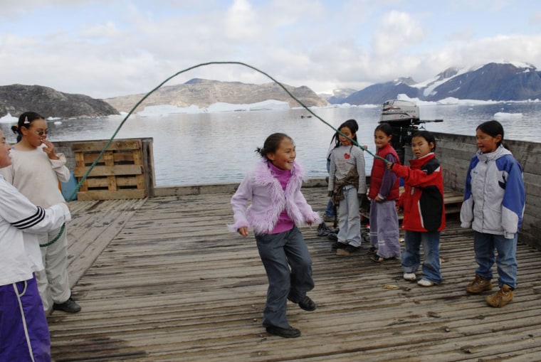 Children playing on a dock of Kullorsuaq
